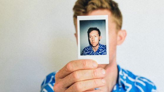 Man showing his own photograph