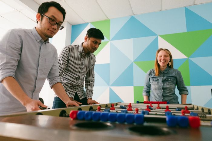 Team EW playing foosball